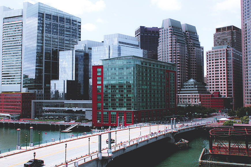 Modern city skyline with bridge and waterfront buildings