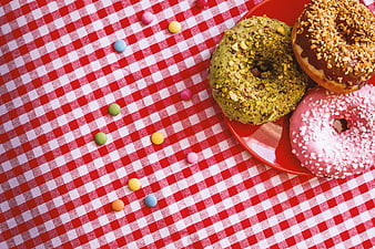 Colorful Donuts on Red Plate with Gingham Tablecloth