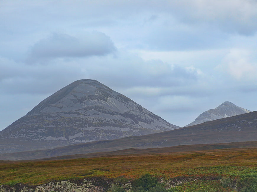 Scenic mountain landscape with rocky peaks and heather moorland