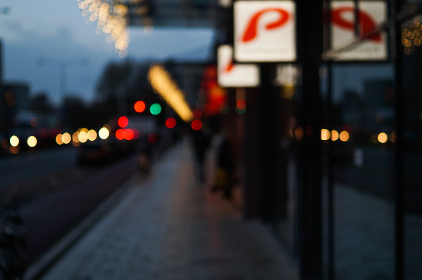 Blurred City Street Scene with Bokeh Lights at Dusk