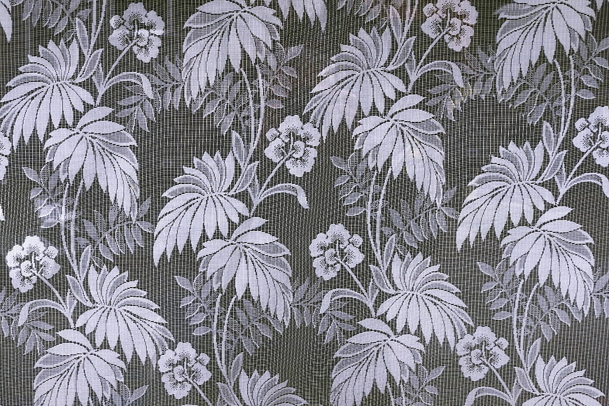 White Floral Lace Pattern On Dark Textured Background