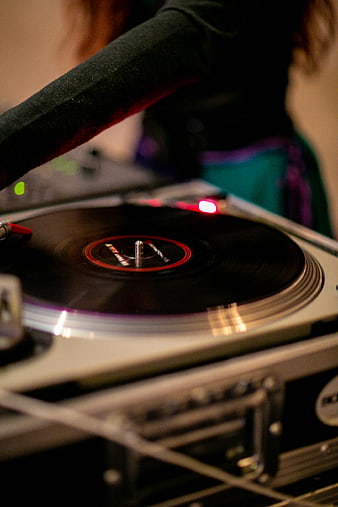 Close-up of DJ Turntable with Spinning Vinyl Record