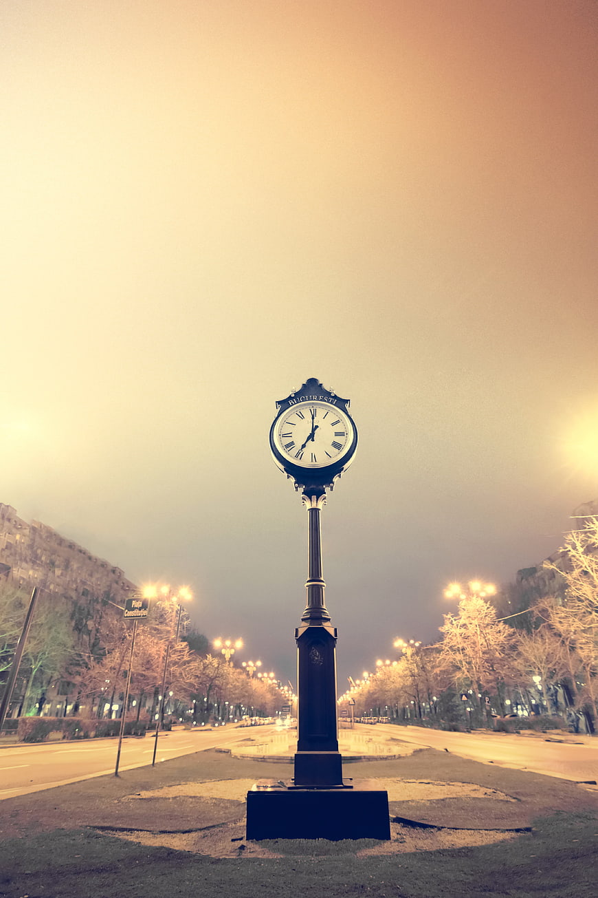 Vintage Street Clock in Bucharest at Dusk
