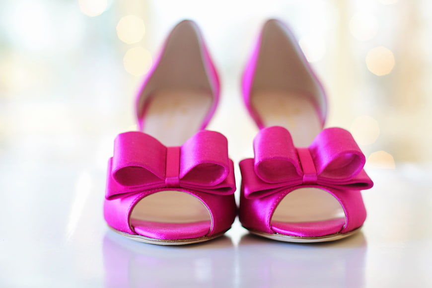 Pink Satin Heels with Bows on White Surface