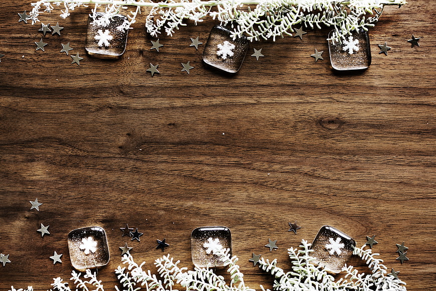Christmas wooden background with snowflakes and stars