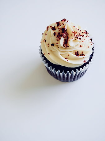 Single Blue Cupcake With White Cream And Sprinkles On White Background