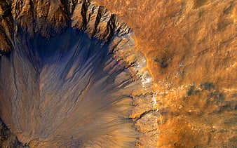 Aerial view of Mars crater with blue and orange terrain