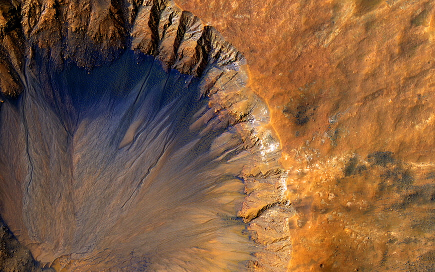 Aerial view of Mars crater with blue and orange terrain