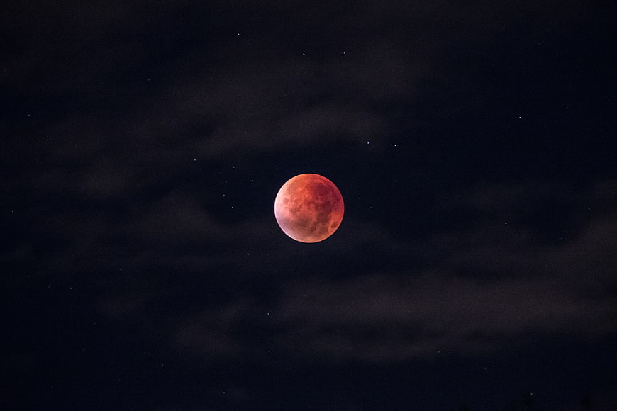Blood Moon Eclipse in Dark Night Sky with Stars