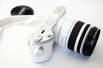 White Samsung NX300 Mirrorless Camera with Lens on White Background