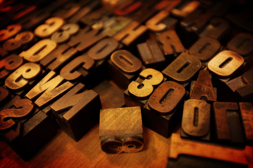 Vintage wooden printing blocks with letters and numbers