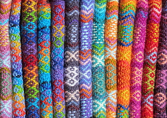 Vibrant multicolored hand-knitted wool yarn texture close-up