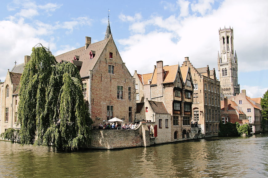 Historic Bruges Canal with Belfry Tower and Medieval Architecture