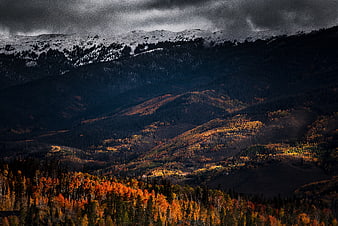 Dramatic Autumn Mountain Landscape with Snow-Capped Peaks