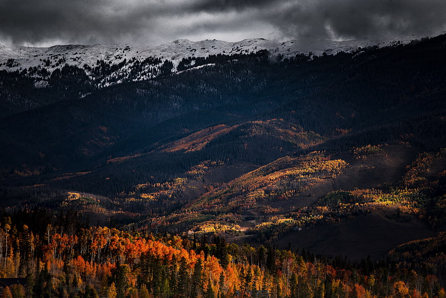 Dramatic Autumn Mountain Landscape with Snow-Capped Peaks