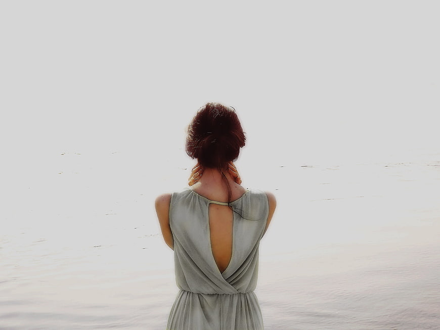 Woman in Grey Dress Looking at Overexposed Sea