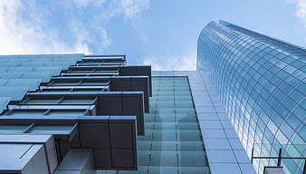 Modern Glass Skyscrapers Against Blue Sky