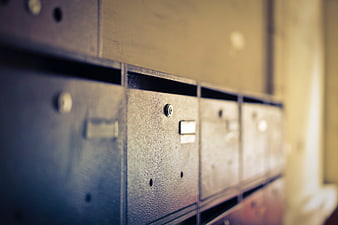 Close-up of vintage metal mailboxes with shallow depth of field