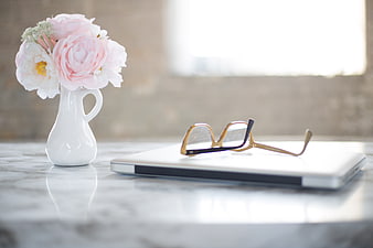 Pink Peonies in White Vase with Glasses on Laptop