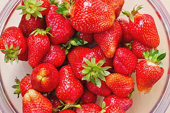 Fresh Red Strawberries in a Glass Bowl Top View
