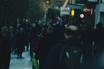 Crowded City Street Scene with Pedestrians Walking