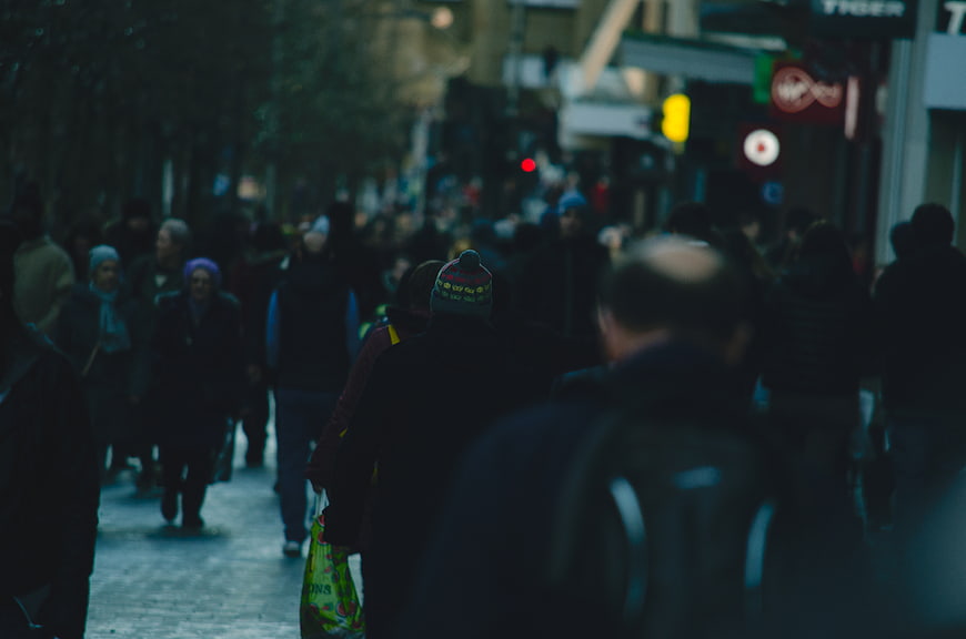 Crowded City Street Scene with Pedestrians Walking