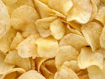 Close-up texture of golden fried potato chips