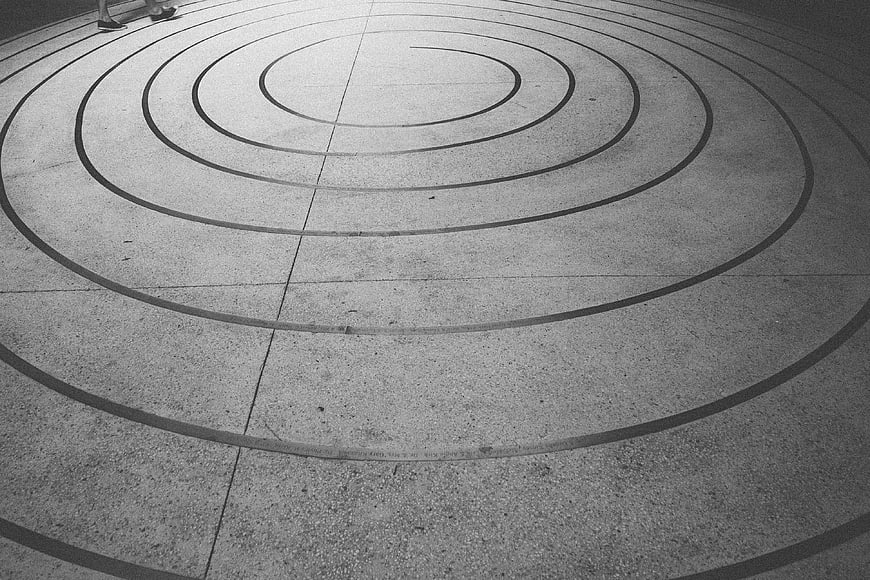 Black and white concentric circles on concrete pavement