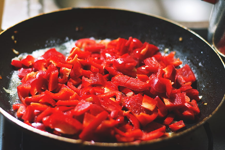 Sautéed Red Bell Peppers in a Frying Pan