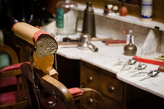 Vintage Barber Shop Chair with Fedora Logo and Tools