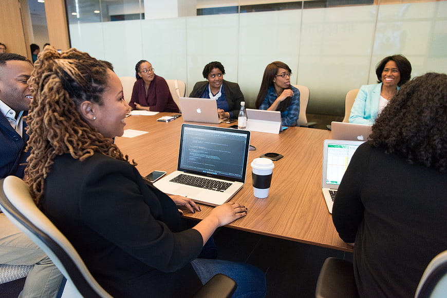 Diverse business team collaborating in modern office meeting