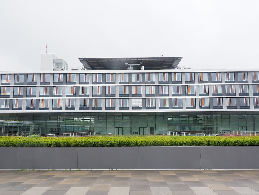 Modern University Hospital Building Facade With Green Hedges