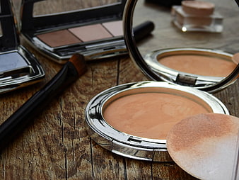Open Makeup Compacts and Brush on Rustic Wood