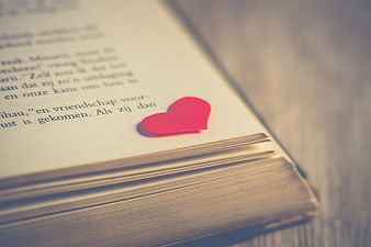 Red Heart Bookmark on Open Book Page