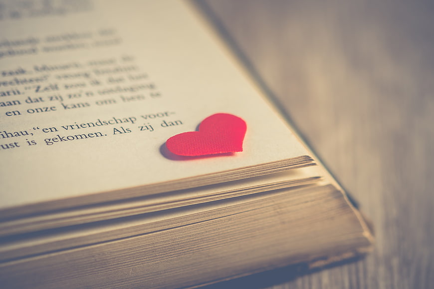 Red Heart Bookmark on Open Book Page