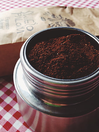 Ground Espresso Coffee in Metal Jar on Checkered Tablecloth