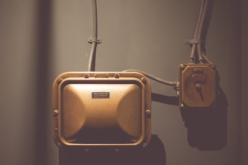 Vintage Brass Electrical Splice Box and Switch on Wall