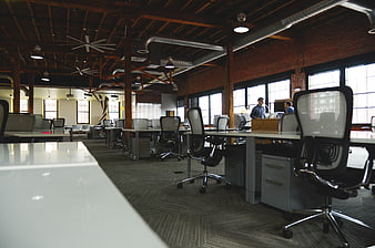 Modern Open Plan Office with Exposed Brick and Industrial Ceiling