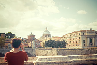 Tourist Photographing St. Peter's Basilica in Rome
