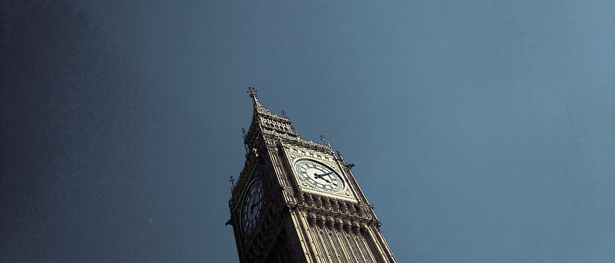 Low angle view of Big Ben clock tower against blue sky