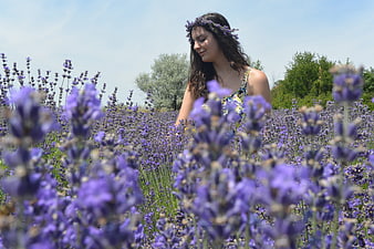 Woman with Lavender Flower Crown in Summer Field