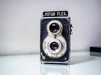 Vintage Votar Flex Camera on White Surface