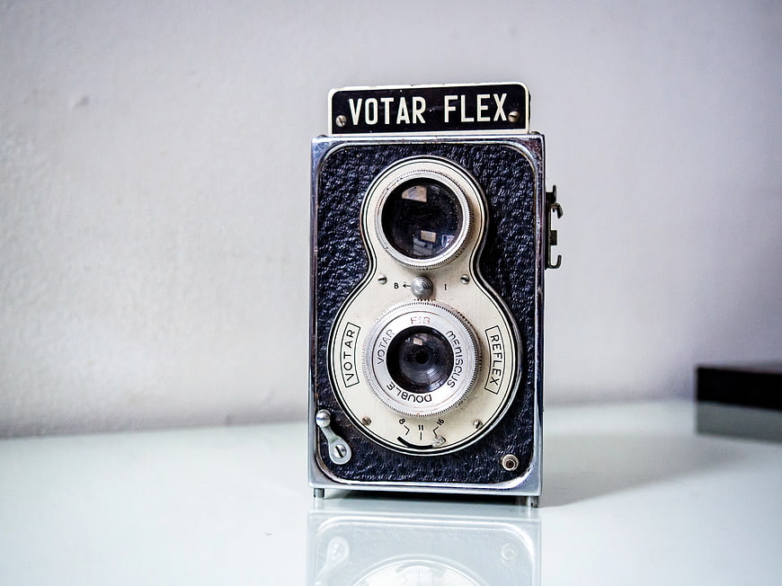 Vintage Votar Flex Camera on White Surface