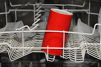 Red Ceramic Cup In Dishwasher Rack