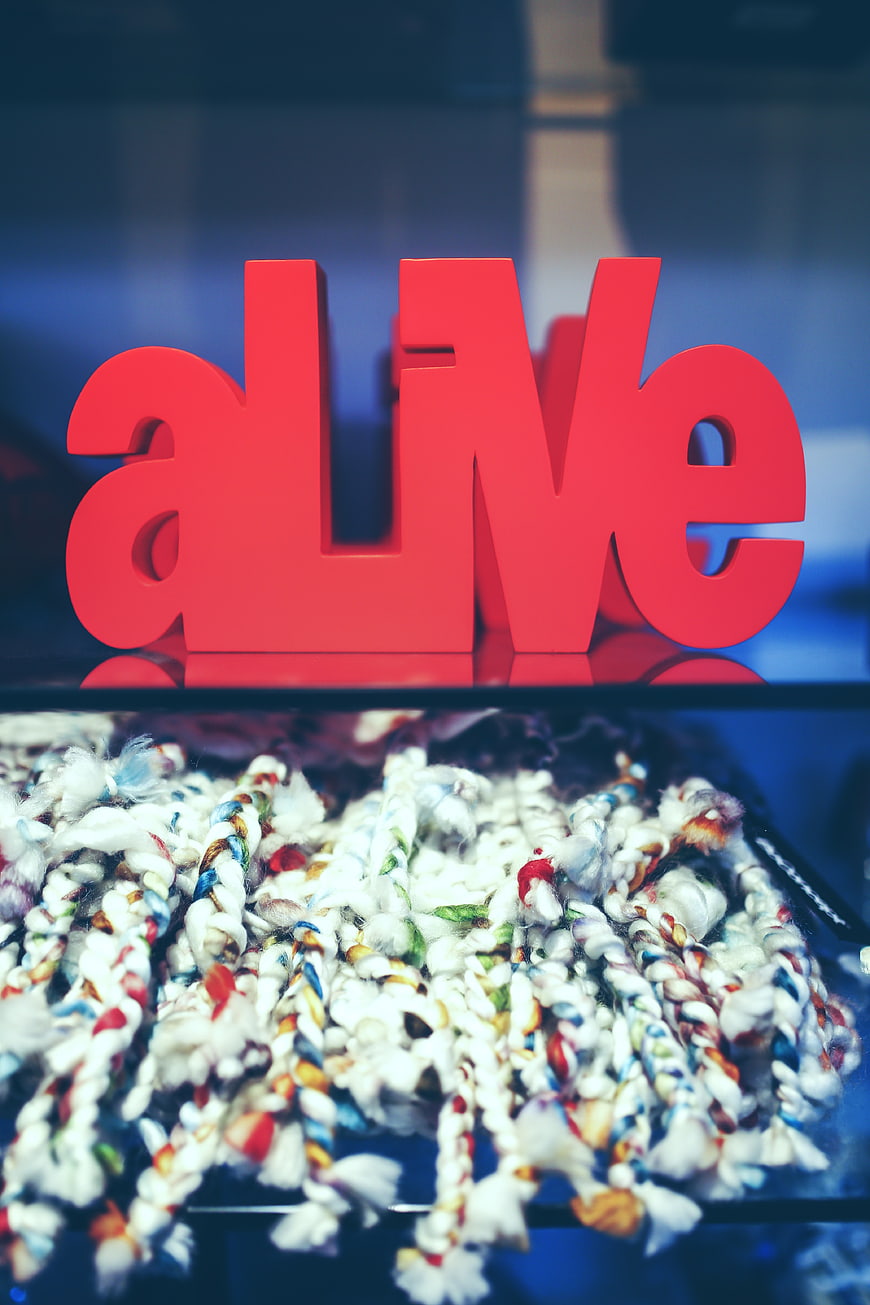 Red Alive Sign with Colorful Braided Textures
