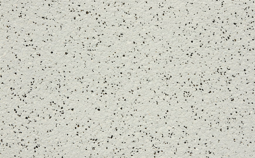 White terrazzo stone texture with black speckles background