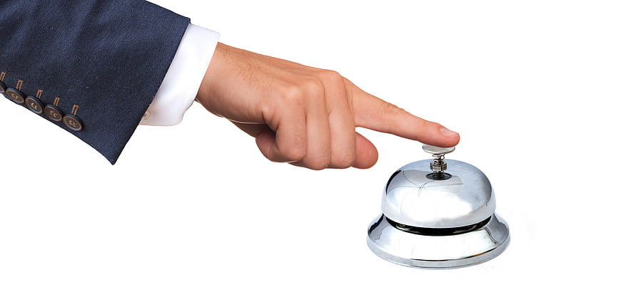 Businessman Hand Ringing Service Bell on White Background