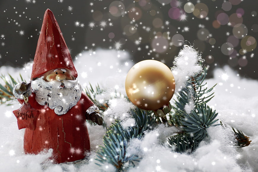 Festive Christmas Gnome Figurine With Gold Ornament And Snowy Pine Branches