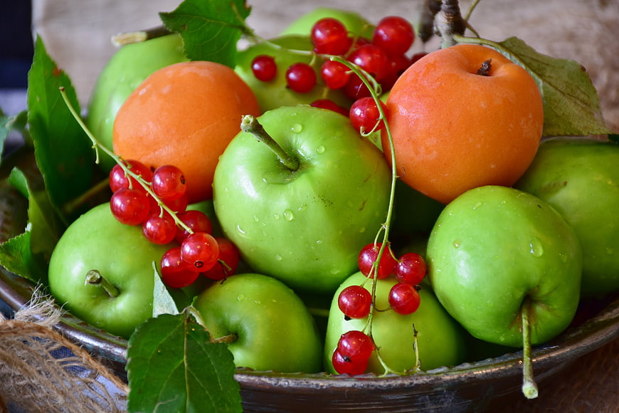 Bowl of Fresh Green Apples, Apricots, and Red Currants