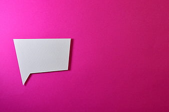 White paper speech bubble on vibrant pink background